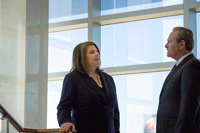 Melanie Radcliff discussing with an employee