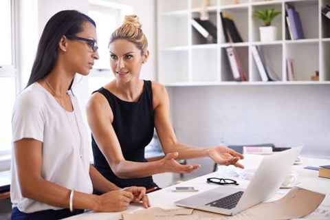 Woman explaining to her colleague