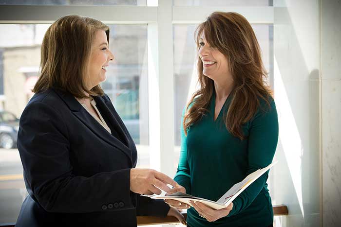 Melanie Radcliff discussing with an employee