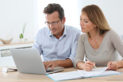 couple discussing about tax on laptop